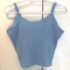 This is a light blue and is cropped tank top. This is from Housebrand!